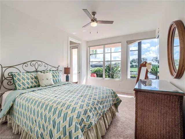 Carpeted bedroom with ceiling fan