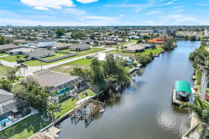 Aerial view featuring a residential view and a water view