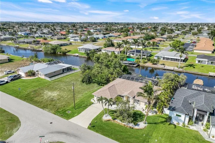 Bird's eye view featuring a water view and a residential view