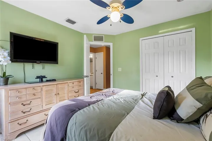 2nd Tiled bedroom featuring a closet and ceiling fan