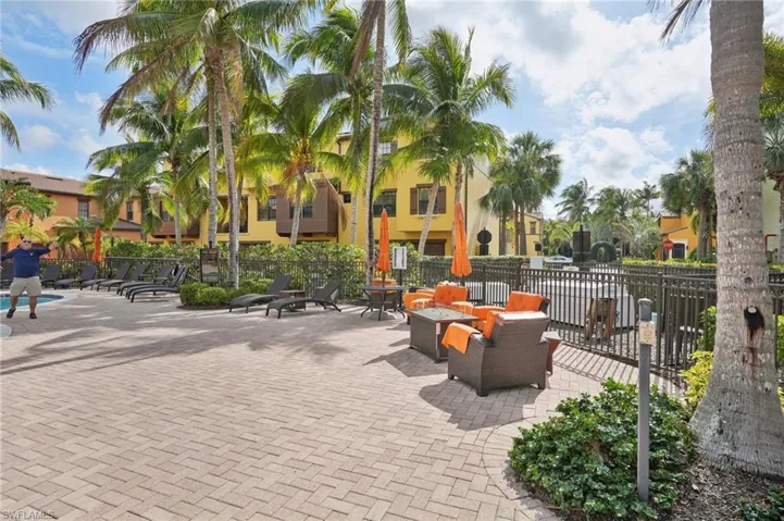 View of home's community with a patio area and fence