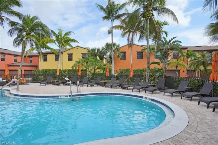 Pool featuring a patio area and fence