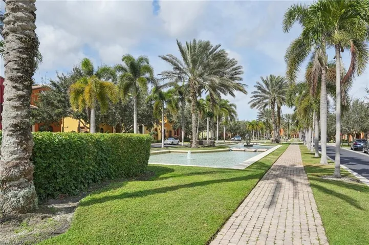 View of property's community with a yard
