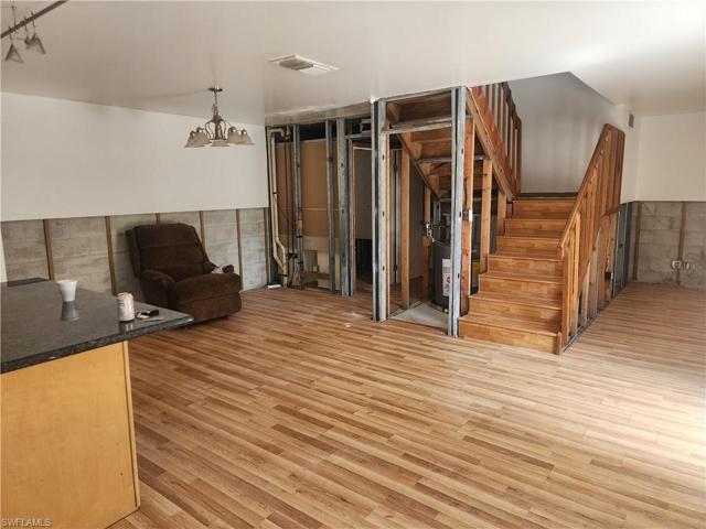 Standing in Kitchen Nook looking towards 1/2 Bath, Laundry, Closet, Stairs and Living Room