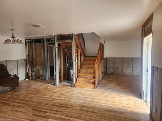 Standing in Kitchen looking towards 1/2 Bath, Laundry, Closet, Stairs and Living Room
