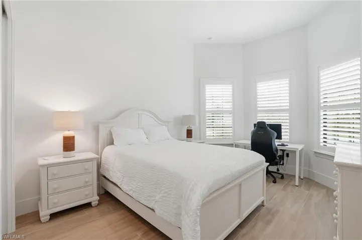 Bedroom featuring light wood-finish flooring and white walls