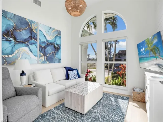 Living room featuring a towering ceiling