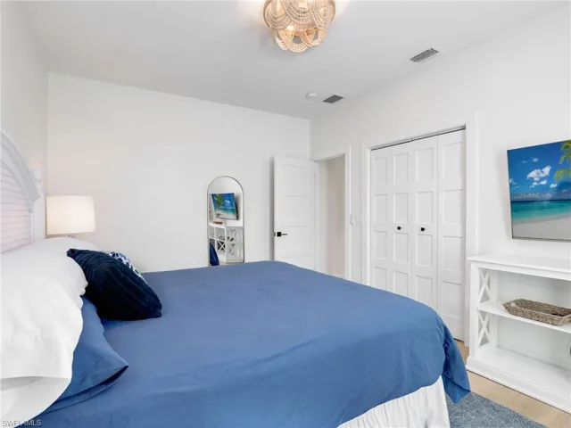 Bedroom featuring hardwood / wood-style floors and a closet