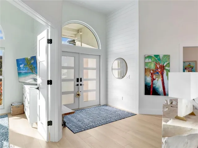 Entryway featuring french doors and light hardwood / wood-style floors