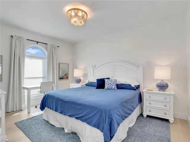 Bedroom with light hardwood / wood-style floors