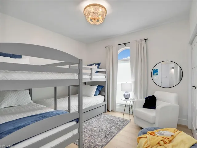 Bedroom with light hardwood / wood-style flooring