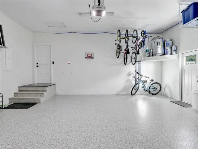 Garage featuring a garage door opener