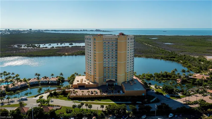 Bird's eye view of a large body of water and apartment complex / building