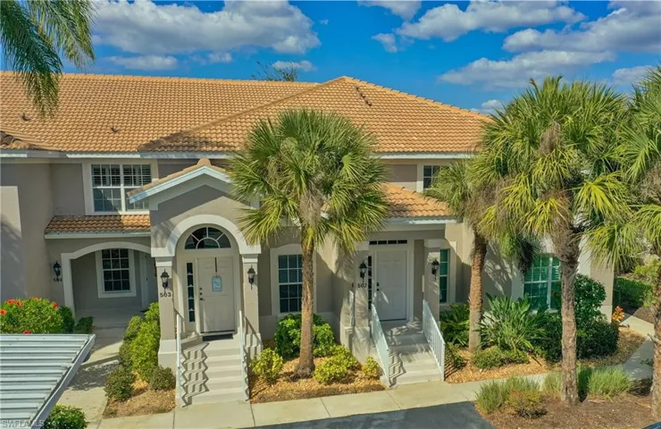 Mediterranean / spanish-style house featuring a tiled roof and stucco siding