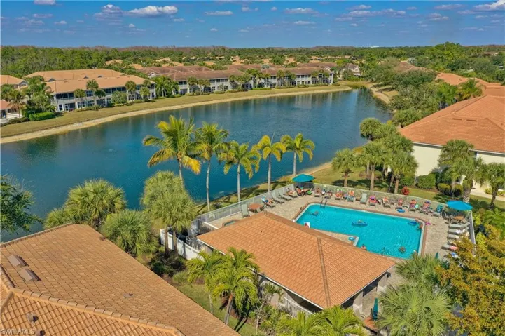 Bird's eye view of a pool area and a large body of water