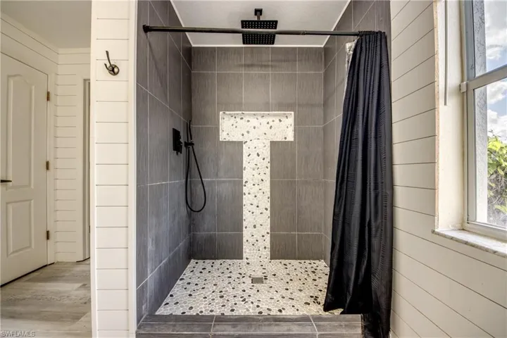 Bathroom featuring a shower stall