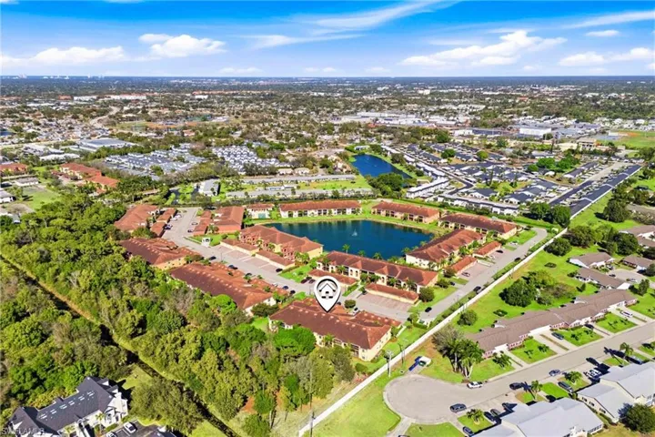 Aerial perspective of suburban area with a large body of water