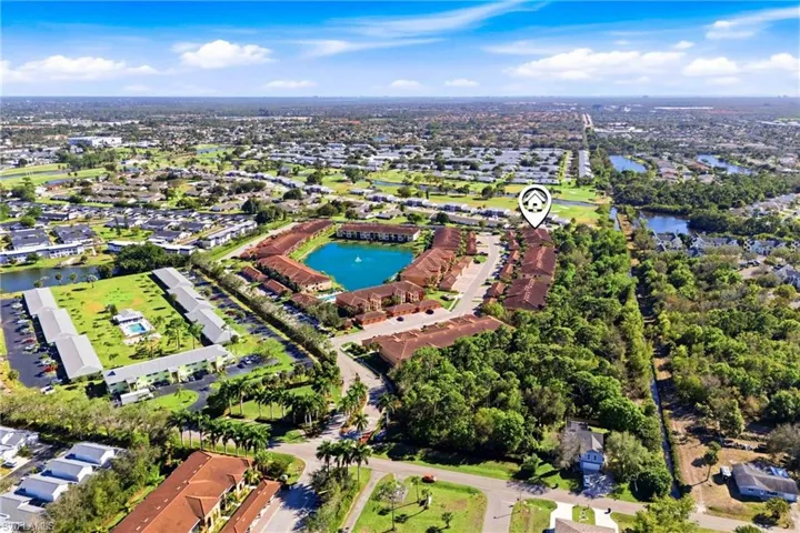 Aerial perspective of suburban area featuring a large body of water