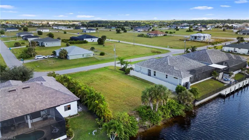 Aerial view of residential area with a nearby body of water