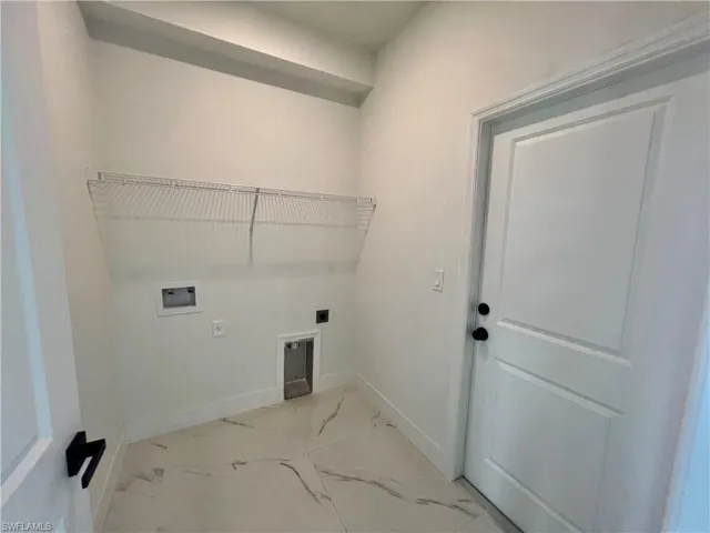 Laundry room featuring washer hookup and electric dryer hookup