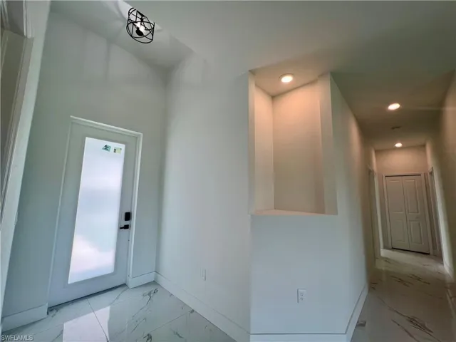 Soaring high ceilings with decorative lighted shelving