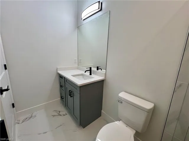 Bathroom with vanity and toilet