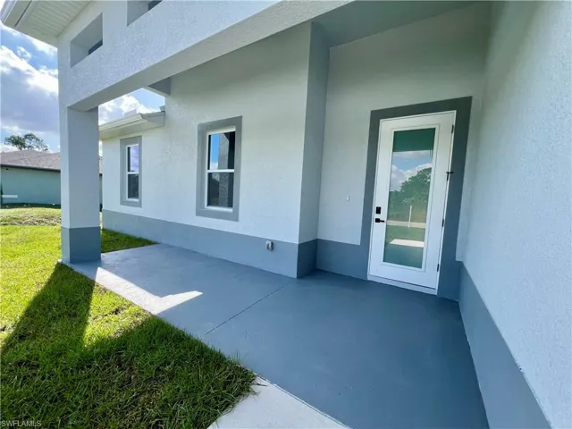 Property entrance with a covered front porch
