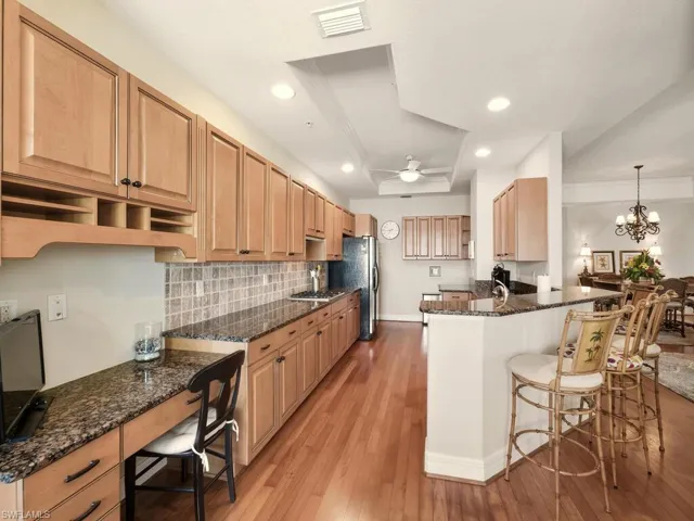Kitchen offers built-in desk & breakfast bar