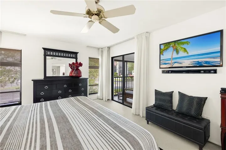 Bedroom with access to exterior and ceiling fan