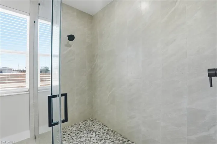 Bathroom featuring a shower stall