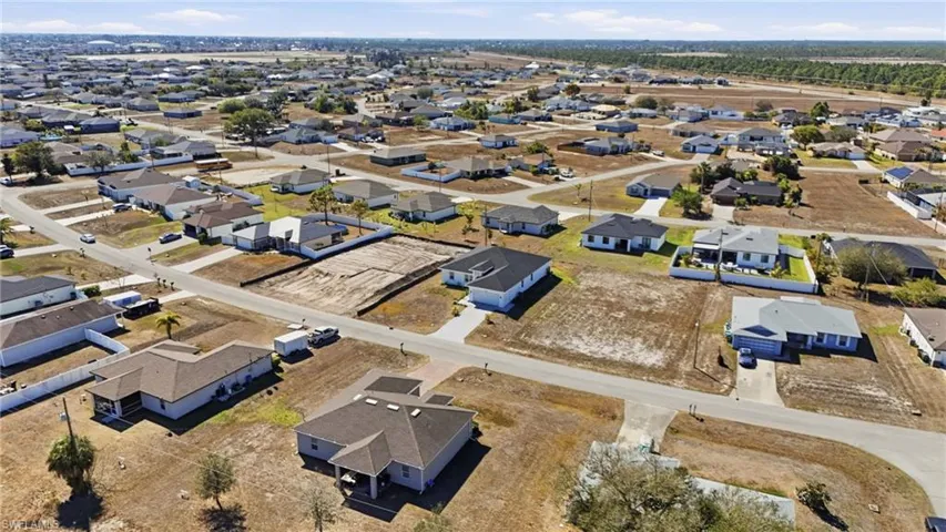Aerial overview of property's location with nearby suburban area