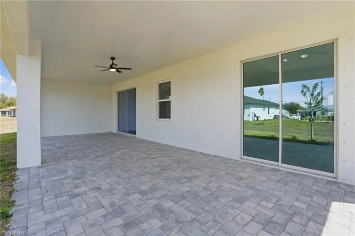 View of patio with a ceiling fan