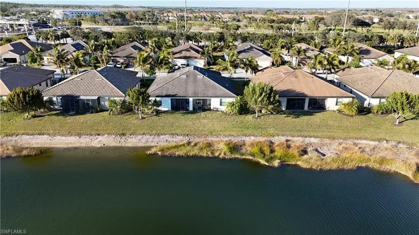 Aerial view of residential area with a nearby body of water