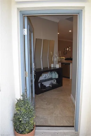 Property entrance featuring stucco siding