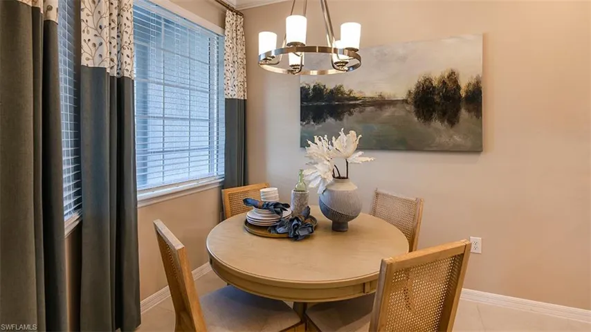 *Tiled dining space with a notable chandelier