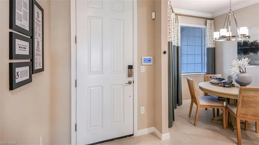 *Entryway with ornamental molding, and a chandelier. The actual unit has 14' ceilings!