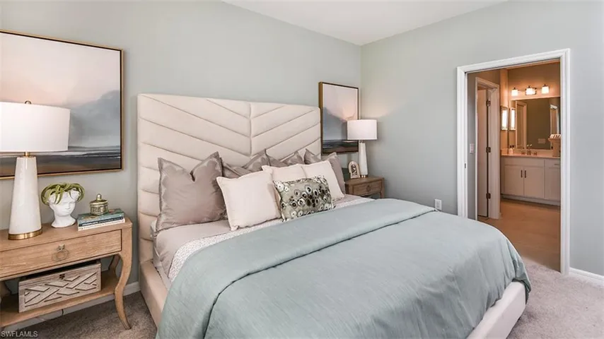 *Bedroom featuring connected bathroom, and carpet floors