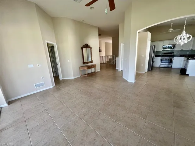 Living room view to kitchen and dining now with furniture moved out