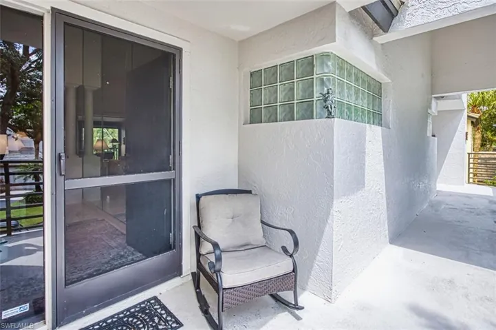 Entrance to property featuring stucco siding
