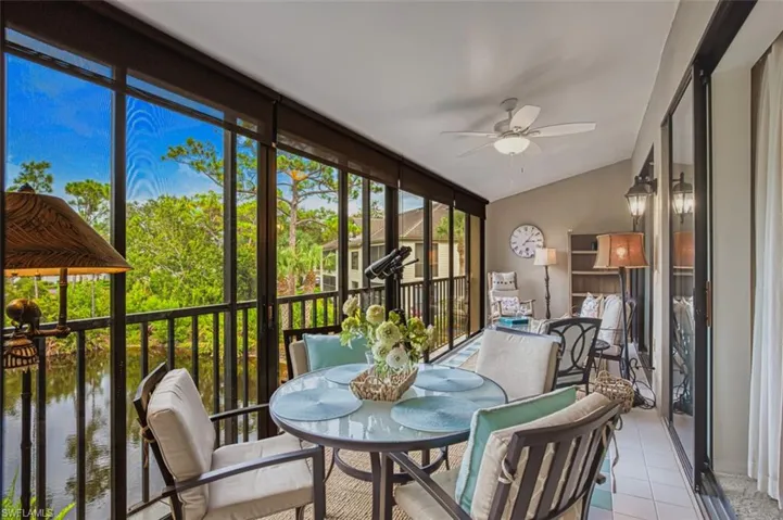 Sunroom featuring ceiling fan and lofted ceiling