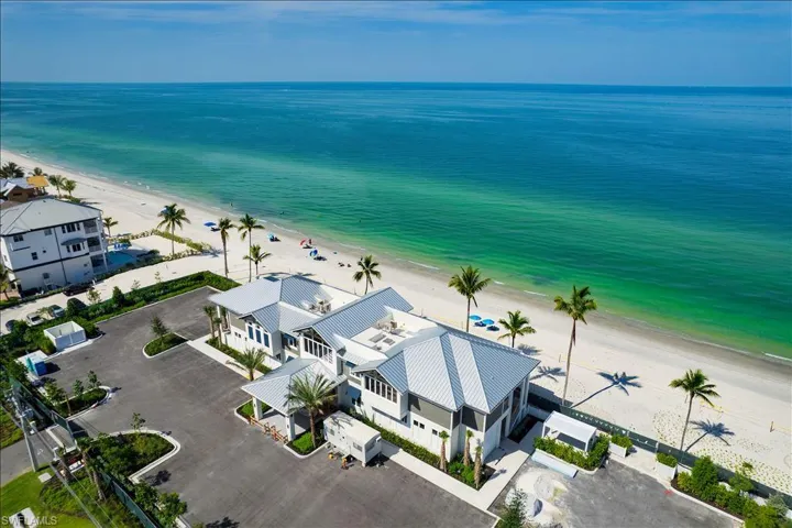 Aerial view of expansive coastline and private beach club for Bonita Bay residents