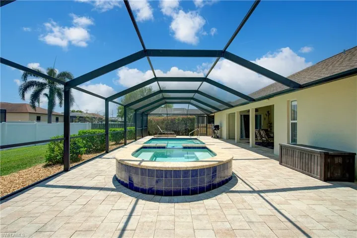 This pool cage space is EXPANSIVE at 58' x 23' (not including the 21' x 13' area under roof)
