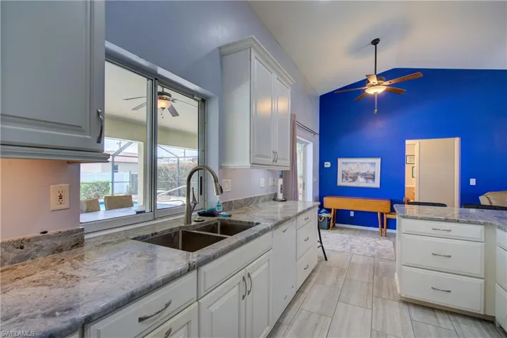 Gorgeous granite countertops and plenty of cabinets for storage