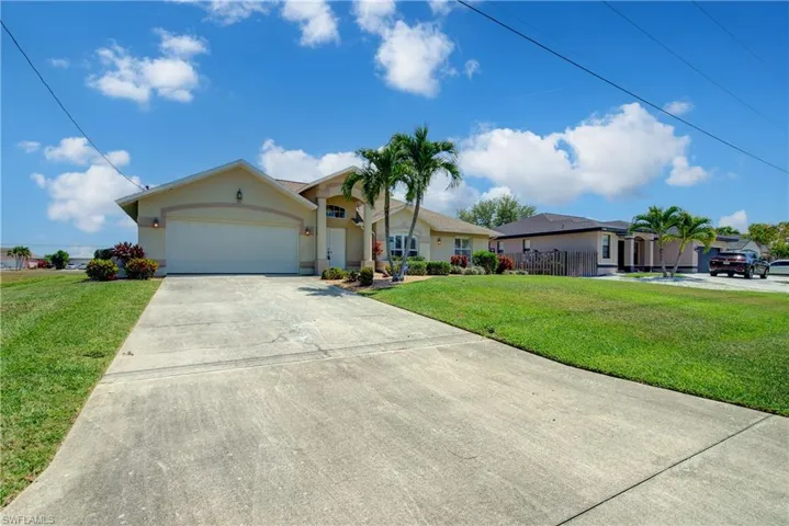 A 2 car garage with plenty of driveway parking. Also, currently a vacant lot to the left of the home