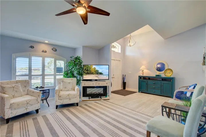 A large bay window provides natural sunlight when you want it. The electric fireplace stays, along with most of the furnishings. Ask for details