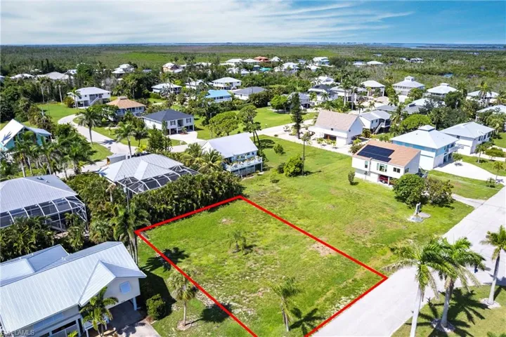 Aerial perspective of suburban area with property parcel outlined