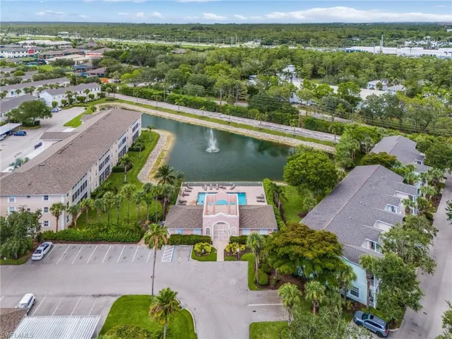 Aerial perspective of a multi-building property featuring a central amenities area