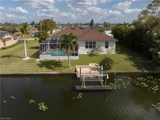 View of dock featuring a motorized boat lift