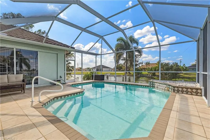 View of swimming pool featuring a view of the canal