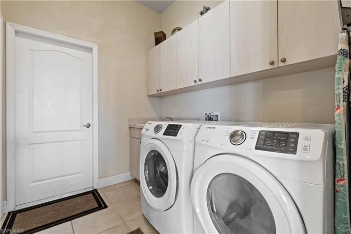 Indoor laundry room with washer and dryer